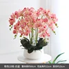 Bacino bianco con orchidea rosa