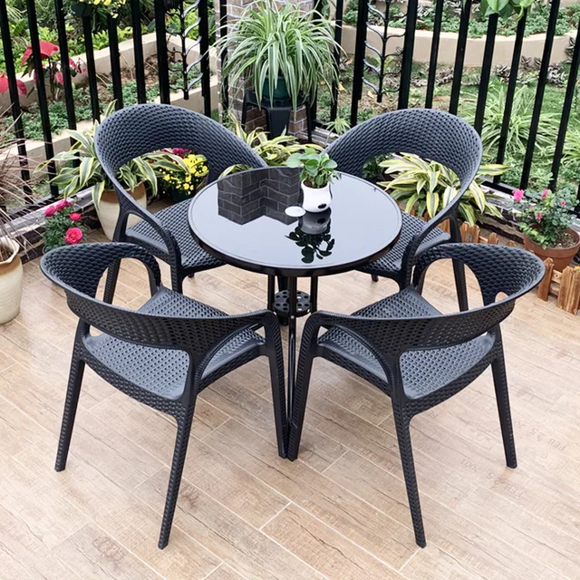 Factory Wholesale Outdoor Dining Patio Table And Chair Set Stacking PP Plastic Stackable PVC Rattan Garden Chairs