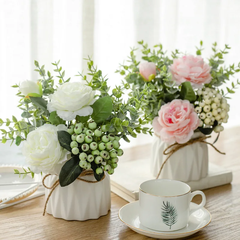 artificial flowers with small ceramic vase