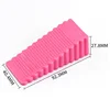 Large pink triangular door stop