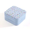 Petite boîte à bijoux carrée, style parfumé bleu.