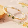 Bracelet doré motif herbe tang allié montagne