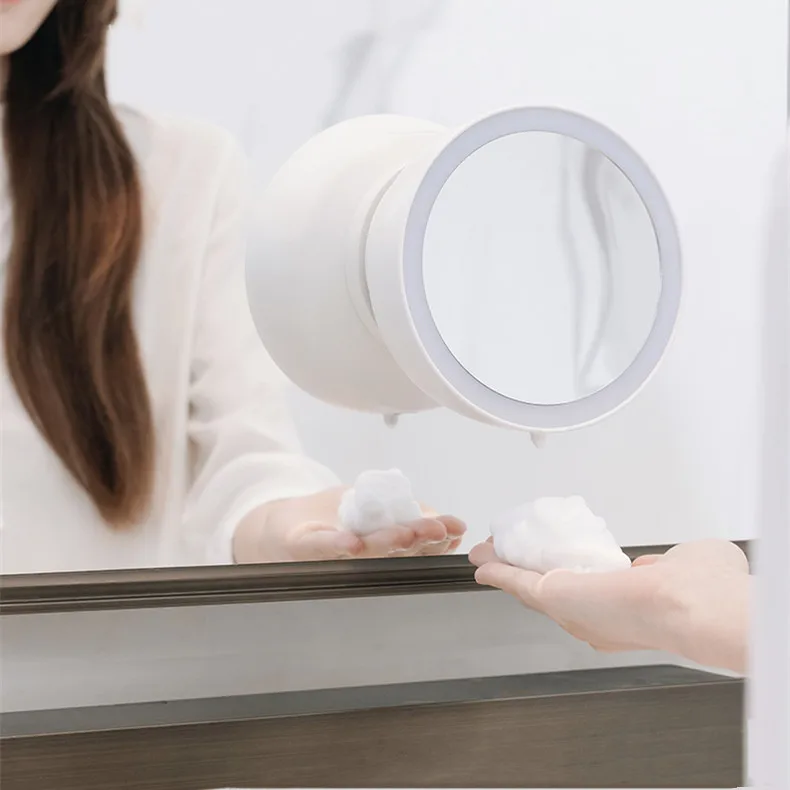 Automatic liquid soap dispenser for mounting behind the mirror