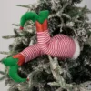 Red and white striped elf legs
