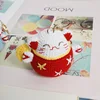 Chat porte-bonheur rouge