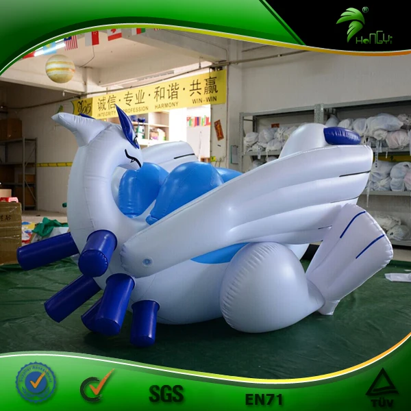 Giant chubby shiny inflatable lugia-looking dragon, standing above