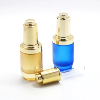 Wholesale custom 30 40ml cosmetic glass bottles blue yellow bottles with electroplate shiny gold serum body oil dropper pump