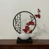 Vertical screen, small white teapot, red plum blossom