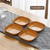 Juego de cuatro piezas de platos pequeños de 14 cm.