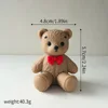 015-orso di peluche scuro-posizione seduta-rosso