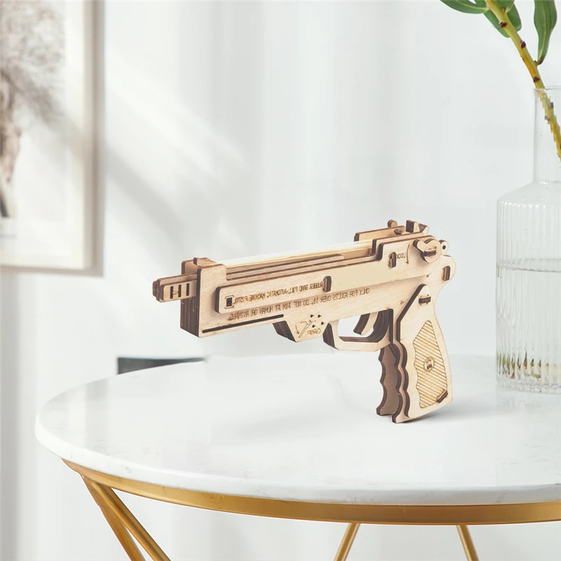 Конкурентоспособная цена, уникальное производство, Резиновая лента, пистолет, 3D модель, детская головоломка, деревянная игрушка «сделай сам»