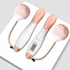 Pink and white handle with rope and small ball