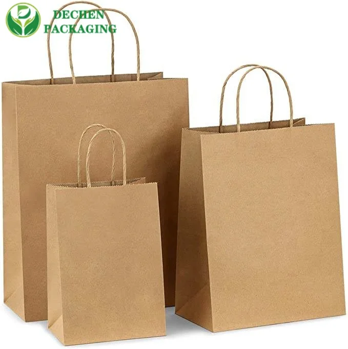 Bolsas de papel marrones con manijas para las compras