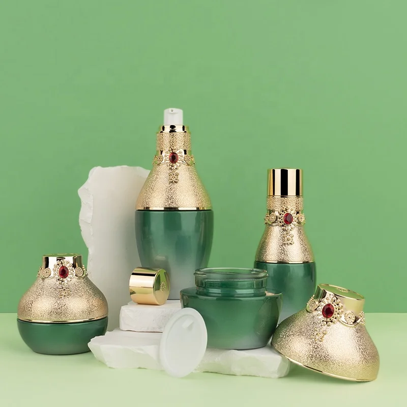 cosmetic packaging red gem decorative green gold cap luxury unique lotion pump cream jar glass bottle set