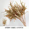 Long, curved willow leaves, autumn orange