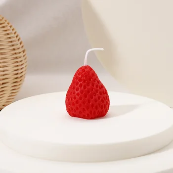 Scented candles in the shape of finished strawberries
