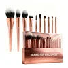 Juegos de brochas de maquillaje en oro rosa