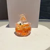 Botella naranja con diseño de calabaza de Halloween.
