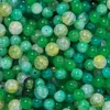 Green-toned bursting glass beads