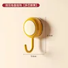 Press the suction cup hook (yellow)
