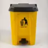 Yellow bucket with black lid for disposal