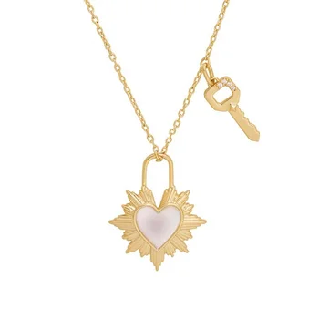 Gemnel striking design a small key charm hangs alongside the heartbeat mother of pearl pendant necklace