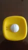 Yellow bowl white ball