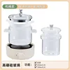 Off-white mechanical-style glass stew pot with glass stewing bowl
