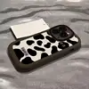 Puff con motivo mucca marrone-nero e bianco