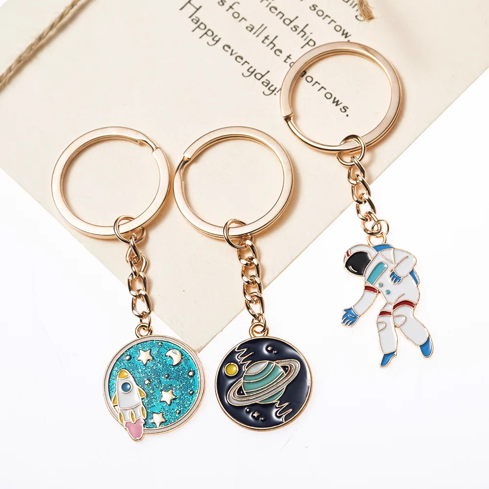 Explosive Keychain Universe Starry Sky Astronaut Dripping Round Keyring Bag Pendant accessories custom From m.alibaba.com
