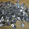 100 triángulos plateados [con tornillos]