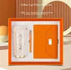 (Naranja) Taza+cuaderno+bolígrafo