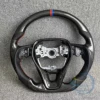 Fibra de carbono; cuero negro; sin botones