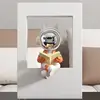 FKD6353U Orange Sitting Learned Astronaut Ornament
