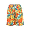Pantaloni da spiaggia con foglie arancioni