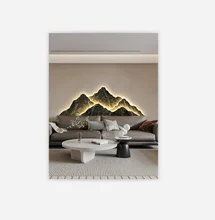 Modern luxurious living room decoration with a picture of a grand sofa backed by a mountain and wall lights on the background
