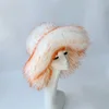 White pointy orange hat