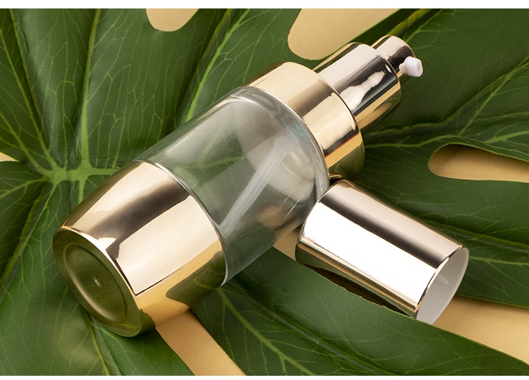 Luxury 30ml round skincare serum lotion bottle cosmetic bottle with gold lotion pump manufacture