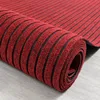 La magie absorbante superbe rouge nettoient le tapis de porte d'entrée