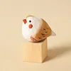 Bloque de madera con pájaro chirriante gordo tallado en madera