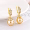 Boucles d'oreilles puces boules dorées