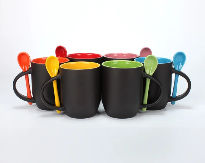 Colorful ceramic mugs with spoons for sublimation