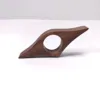 Black walnut wood book-holding clips - one side with a curved bottom