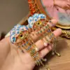 Orecchini con frange di ciglia blu