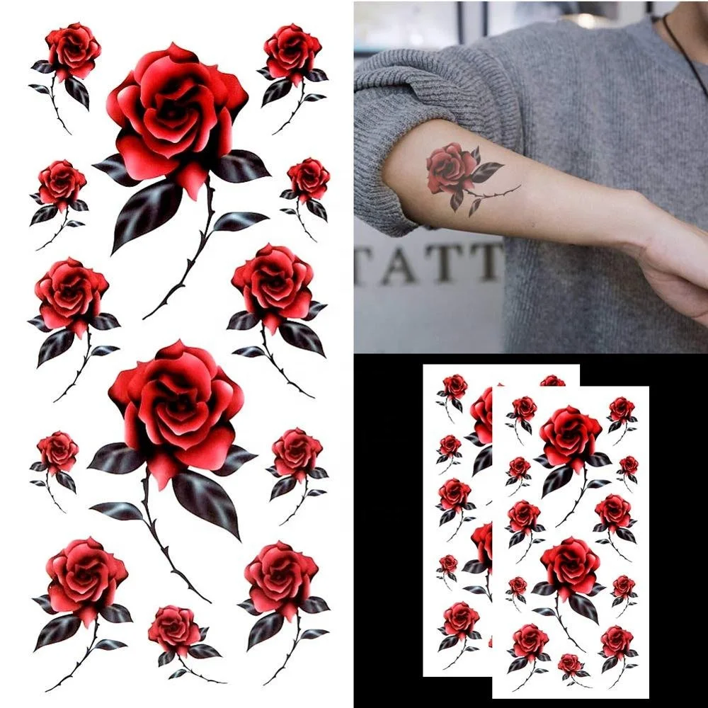 Microrealistic red rose tattoo located on the top of