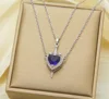 Ciondolo in rame con zircone viola