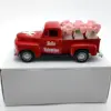 Camioncino rosso + 6 vasi di rose rosa