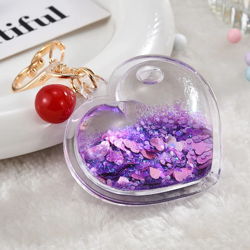 Hot sale heart shape double side transparent plastic keychain glitter fluid acrylic keychain for gifts supplier