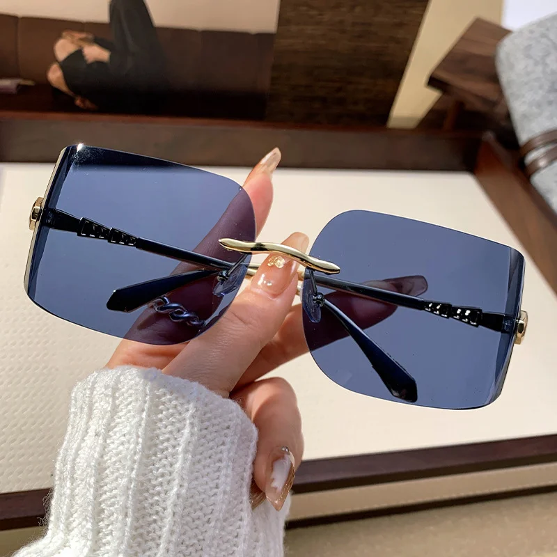 2025 Retro Rimless Snake-Shaped Metal Sunglasses Square  display picture 1