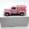 Camioncino rosa + 6 vasi di rose rosa